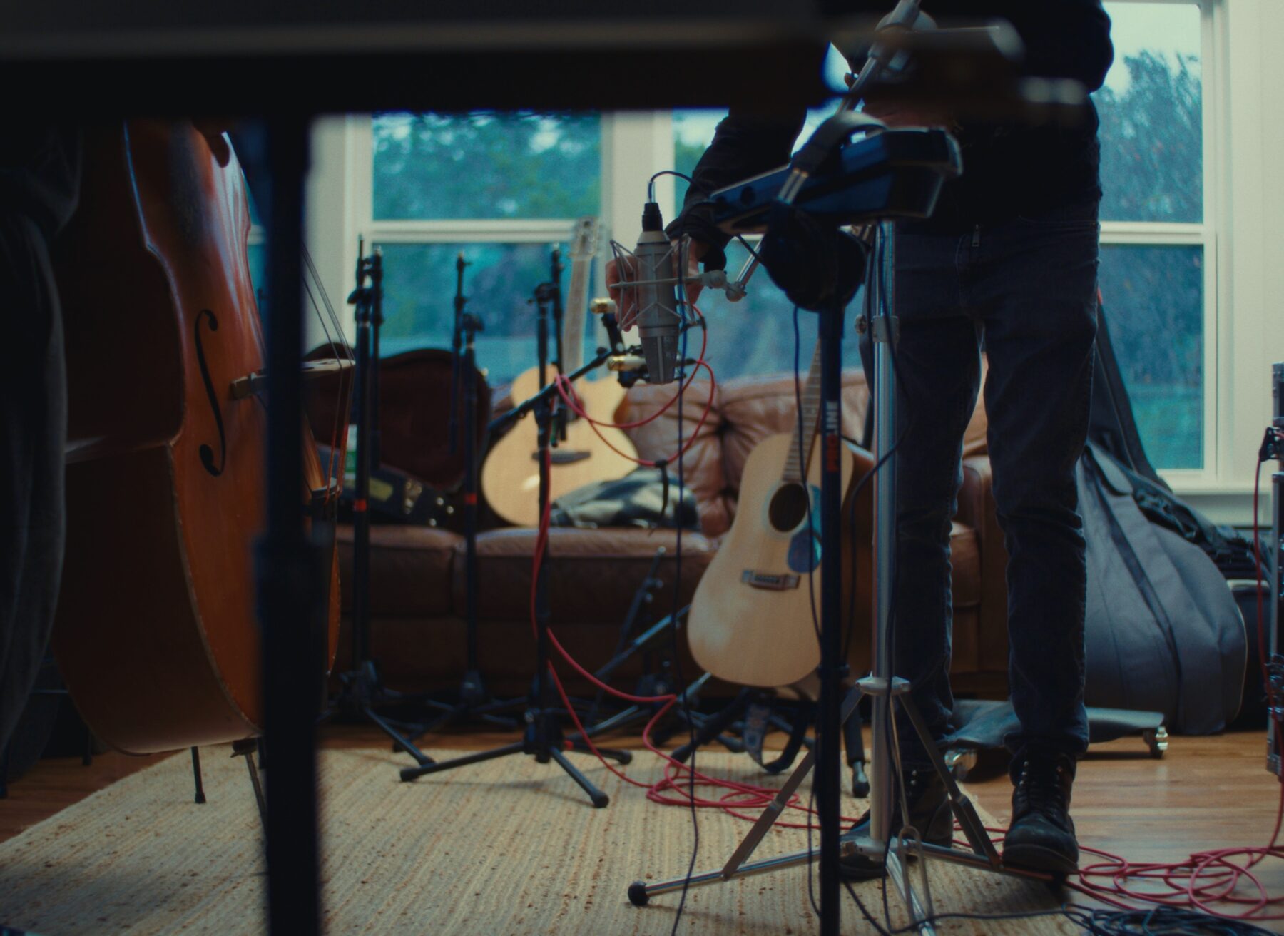 Microphones and instruments set up in the living room