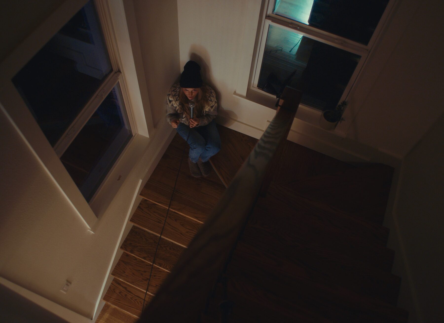 Katrina Cain recording vocals in the stairwell